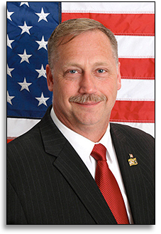 Ron Fisher being sworn into office